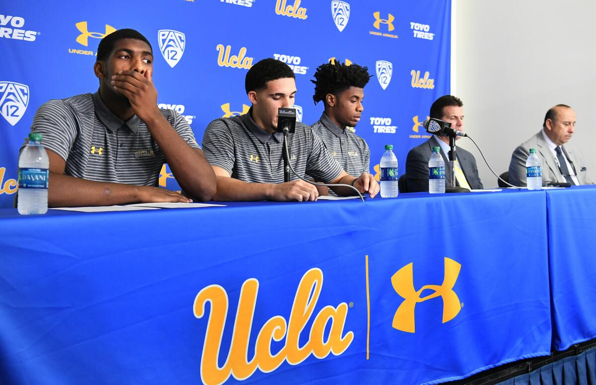 UCLA basketball players (from left) Cody Riley, LiAngelo Ball and Jalen Hill give statements at Pauley Pavilion about the events in China during a news conference Wednesday.