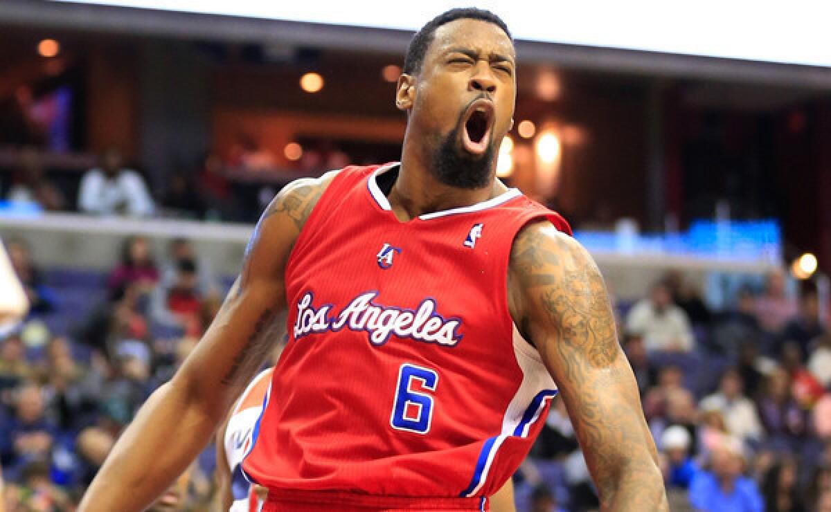DeAndre Jordan reacts after dunking the ball against the Washington Wizards on Saturday night. Jordan has spearheaded the Clippers' defensive effort this season.