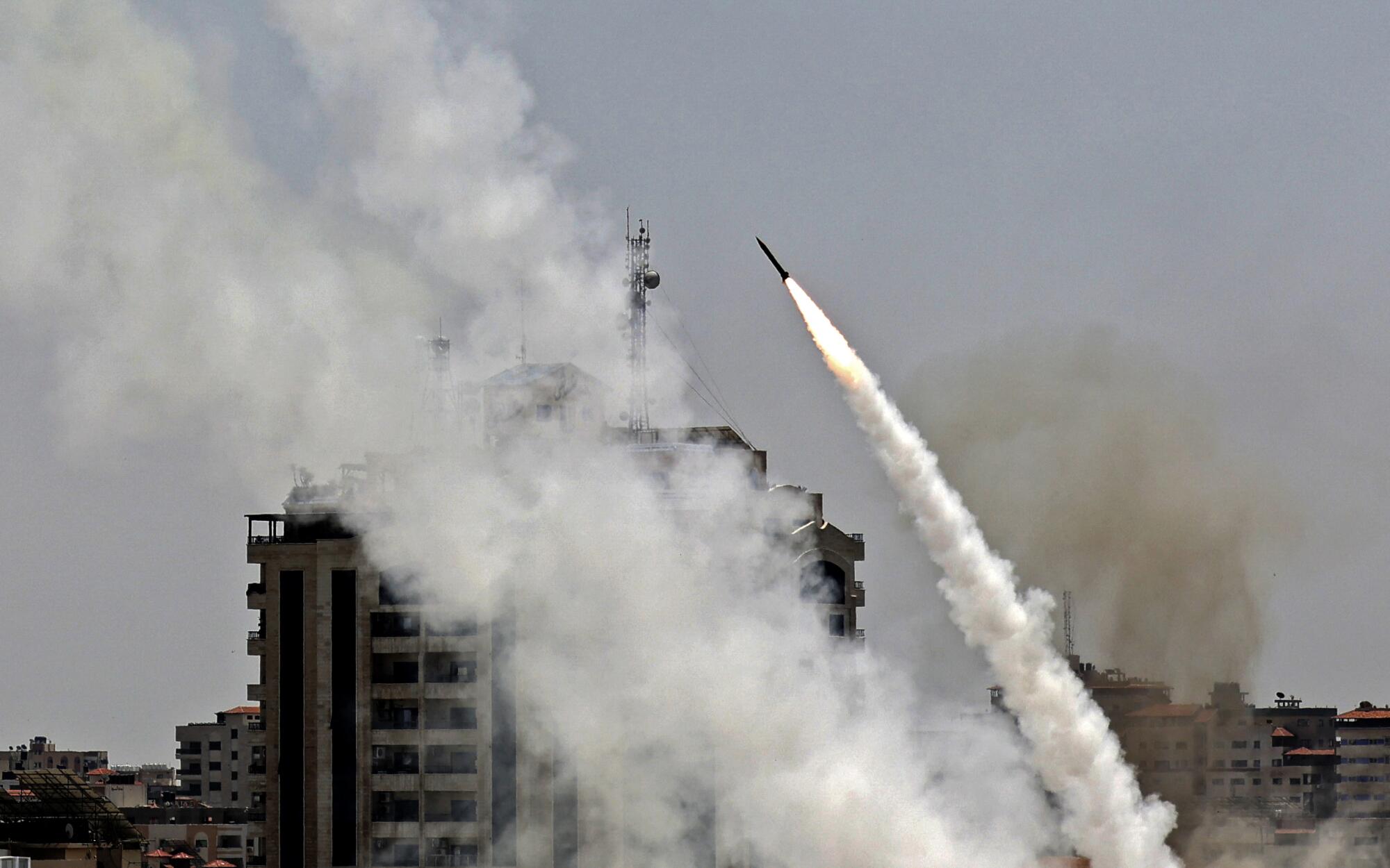 Rocket takes to the sky with a trail of smoke 