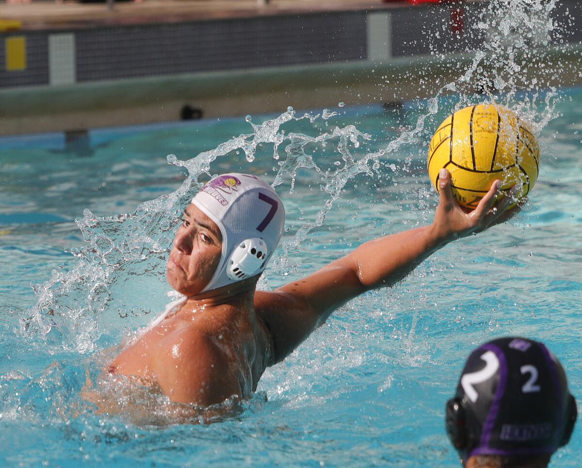 Burbank's Jonathan Agazaryan leans back to shoot against Hoover in a Pacific League boys' water polo match at Hoover High School on Thursday, October 10, 2019. Hoover won the match.