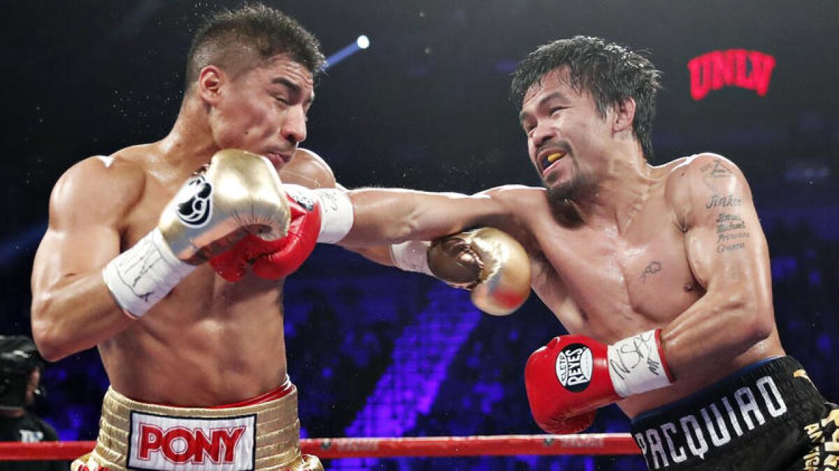 Manny Pacquiao connects to the face of Jessie Vargas during their WBO welterweight title bout in Las Vegas on Saturday night. To see more images, click on the photo above.