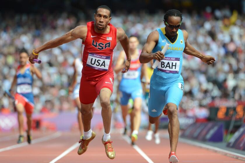 USC's Bryshon Nellum, shown competing in the 2012 Olympic Games at London next to the Bahamas' Chris Brown, won the NCAA 400-meter championship last weekend.