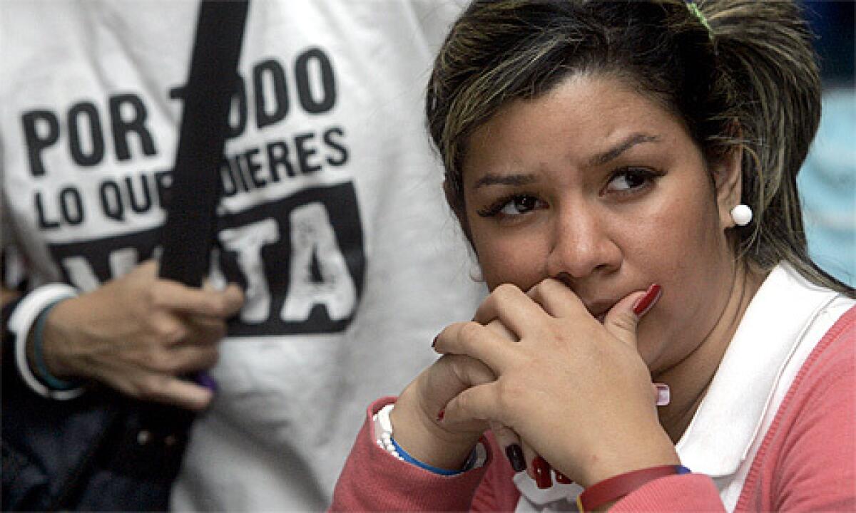 An voter opposed to Sunday's referendum awaits results in Caracas.