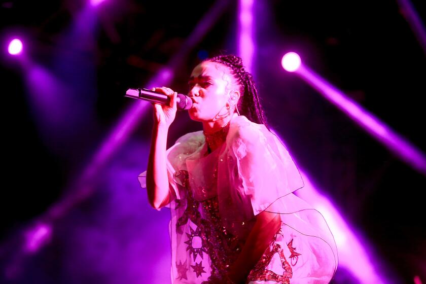 British singer FKA Twigs, a.k.a. Tahliah Barnett, performs on Day 2 of the Coachella Valley Music and Arts Festival.