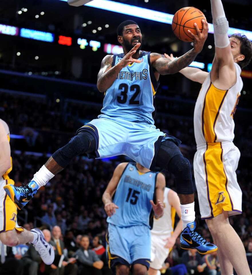 Grizzlies guard O.J. Mayo goes for a reverse layup against Pau Gasol and the Lakers in the second half Sunday night at Staples Center.