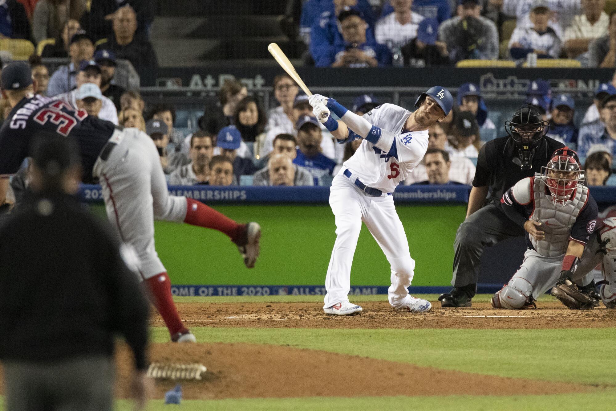 Washington Nationals starting pitcher Stephen Strasburg strikes out Dodgers center fielder Cody Bellinger during the fifth inning of the Dodgers' NLDS Game 2 loss Friday.