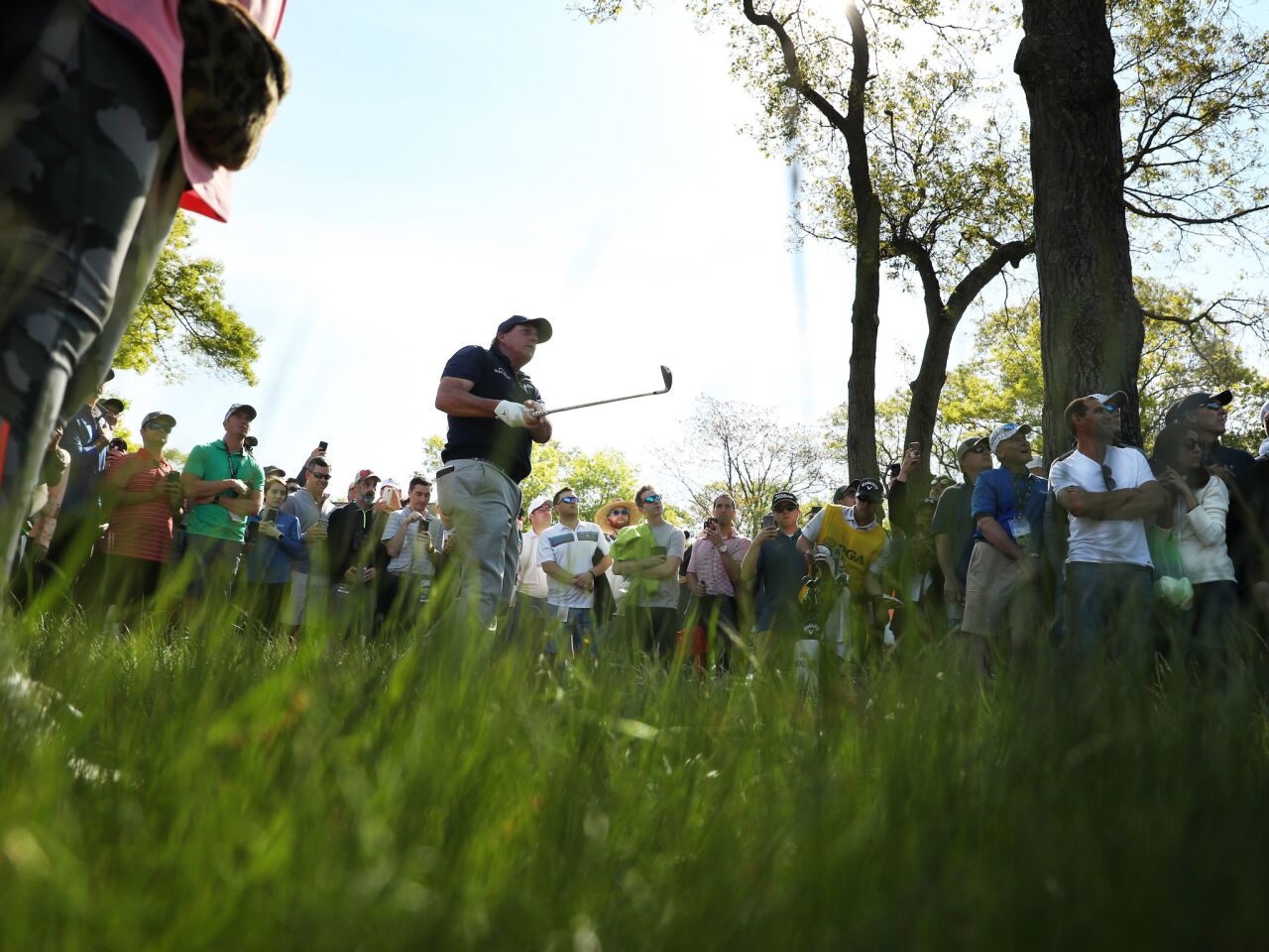Phil Mickelson of the United States plays his shot on the tenth hole during the second round of the 2019 PGA Championship at the Bethpage Black course in Farmingdale, New York.