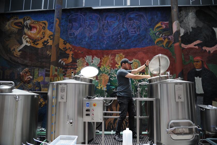 Brewer Armando from Cru Cru Brewery works at Cru Cru Factory where the Amigous Craft Beer -displaying an image of US President Donald Trump- is fabricated, in Mexico City, on June 15, 2017. / AFP PHOTO / Bernardo Montoya (Photo credit should read BERNARDO MONTOYA/AFP via Getty Images)