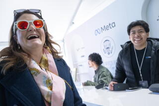 A woman tries Meta smart glasses during the annual White House Easter Egg Roll
