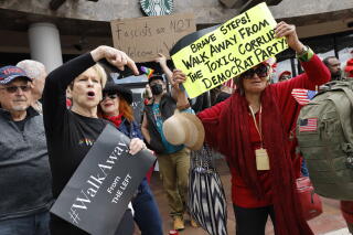 Members of the #Walkaway movement rally on the corner of Santa Monica and Robertson.