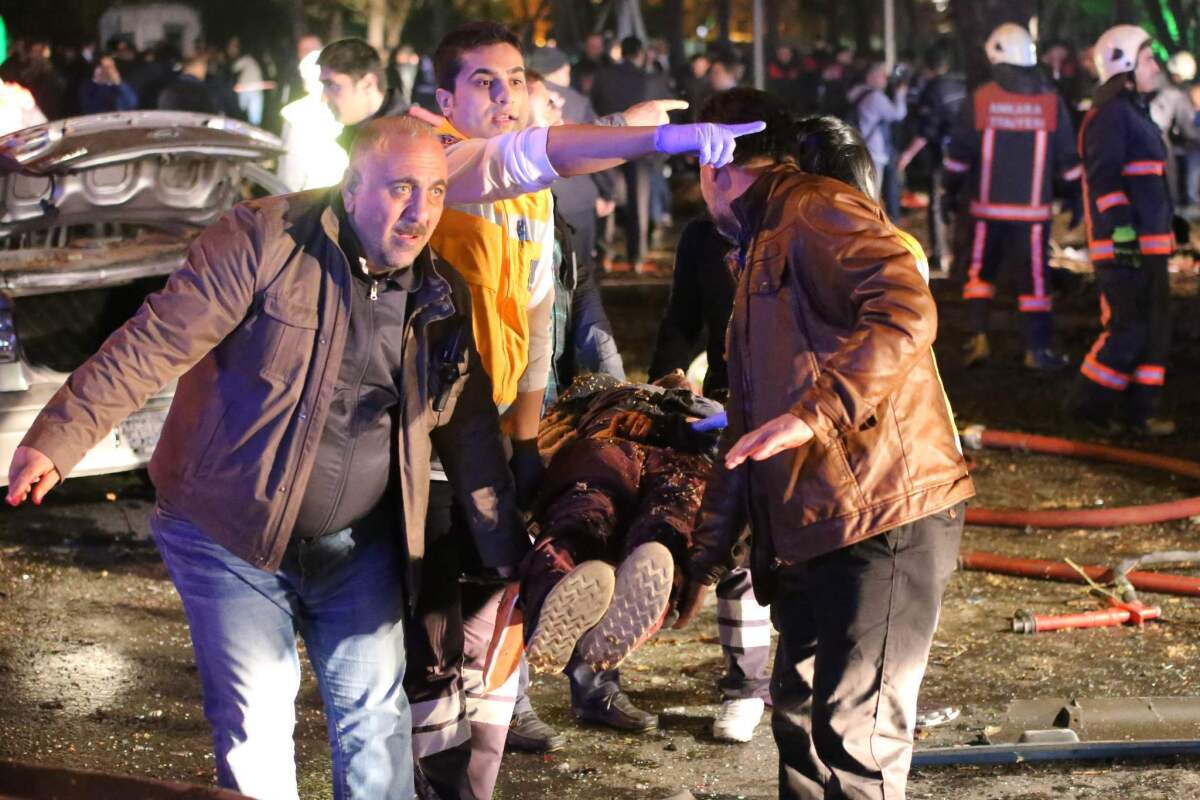 An injured person is carried away on a stretcher at the scene of a blast in the Turkish capital of Ankara on Sunday.