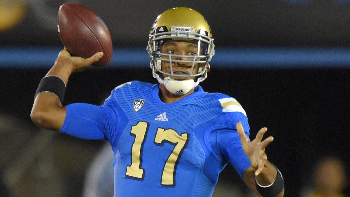 UCLA quarterback Brett Hundley passes during the first half of the Bruins' game against USC.