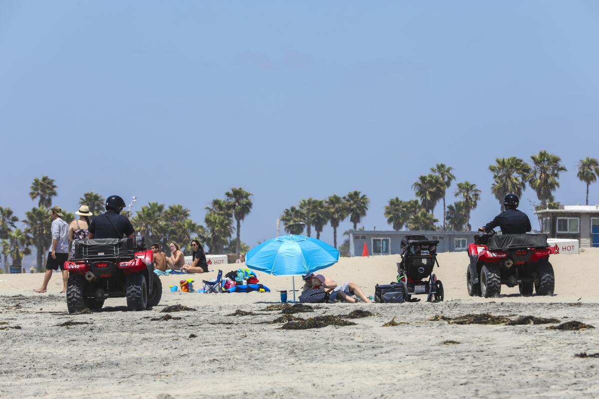 Visitors at Ocean Beach were violating orders by lounging on the sand on Memorial Day. But beginning Tuesday, San Diego County will allow passive use of all beaches.