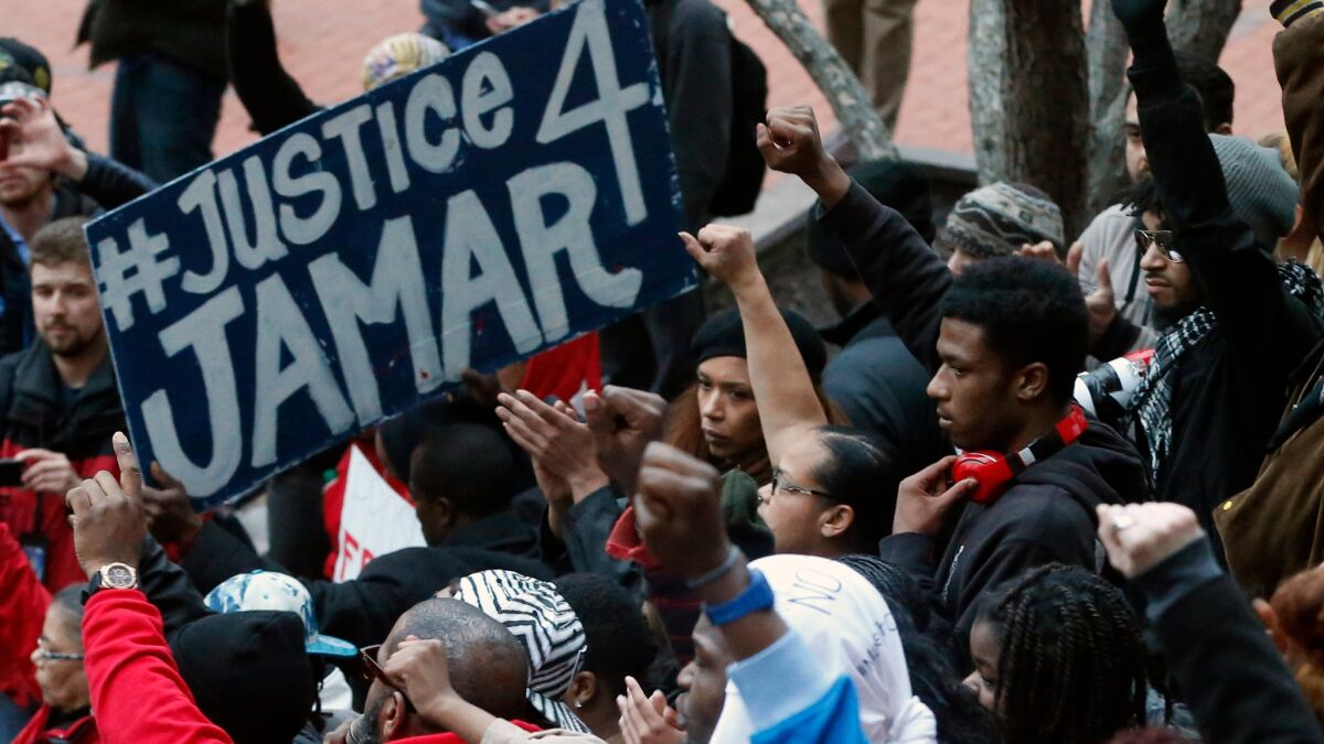 Demonstrators protest the fatal Minneapolis police shooting of Jamar Clark in 2015.