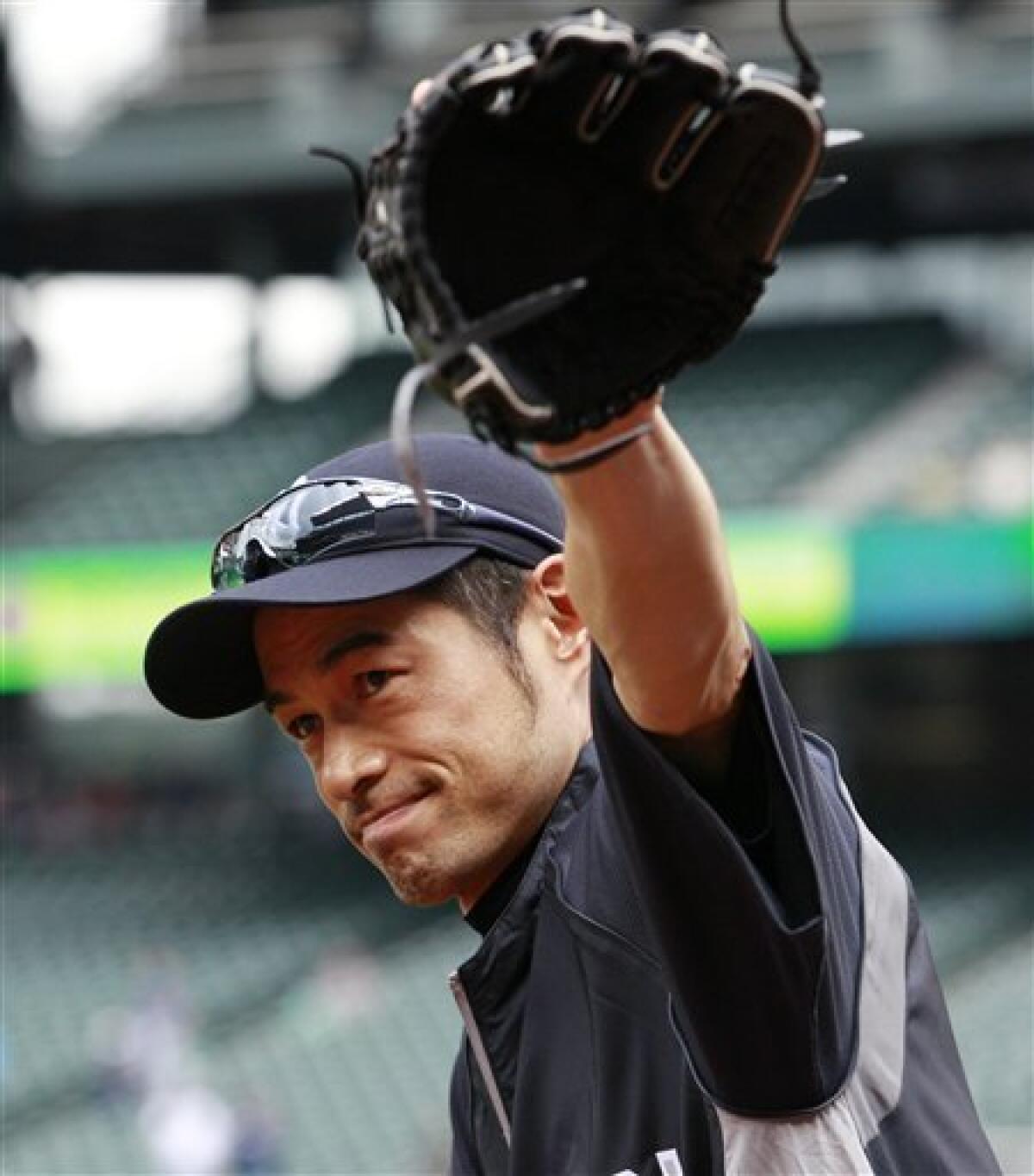 Seattle Mariners' Ichiro Suzuki holds his bat as he stands in the