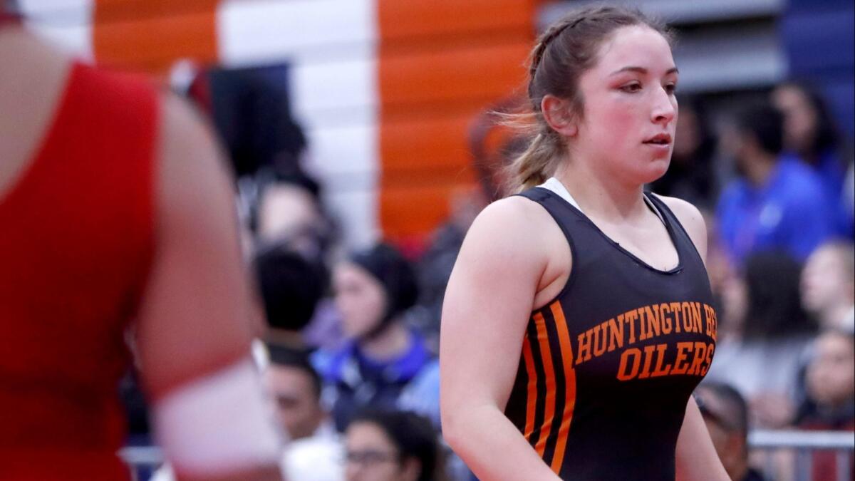 Huntington Beach High's Chloe Belman, shown during competition on Friday, finished third at 143 pounds Saturday at the CIF Southern Section Girls' Wrestling Championships.