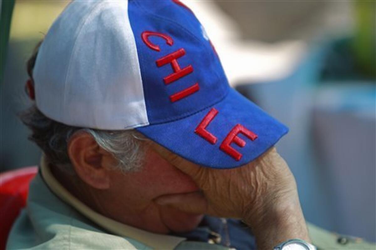 Wearing a cap with the colors of the Chilean flag, Paulino Mesa, uncle of Raul Bustos, has a nap at the relatives camp at the San Jose Mine near Copiapo, Chile Tuesday, Oct. 12, 2010. Andres Sougarett, the Chilean engineer leading the rescue effort, said all would be in place at midnight Tuesday to begin the rescue of the 33 trapped miners. (AP Photo/Natacha Pisarenko)