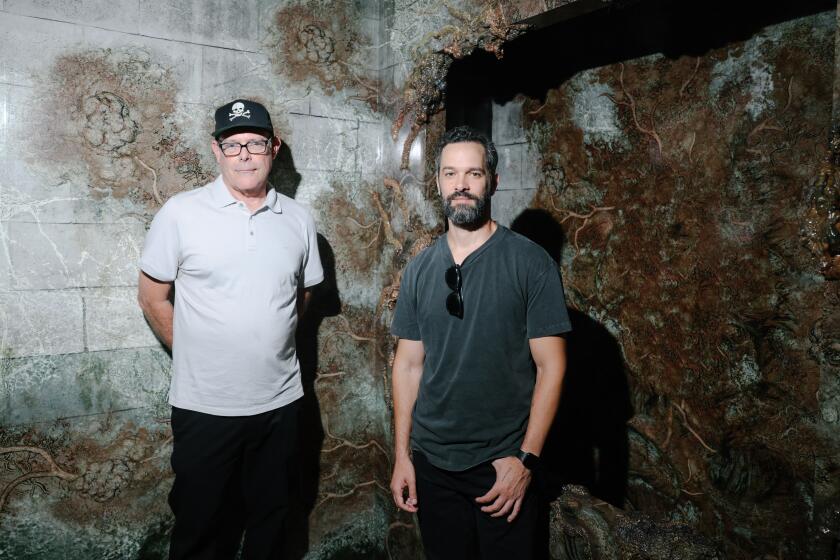 Los Angeles, CA - August 30: Maze creator John Murdy, left, and video game creator Neil Druckmann, right, for "The Last of Us" pose for a portrait at Universal Studios Hollywood on Wednesday, Aug. 30, 2023 in Los Angeles, CA. (Dania Maxwell / Los Angeles Times)