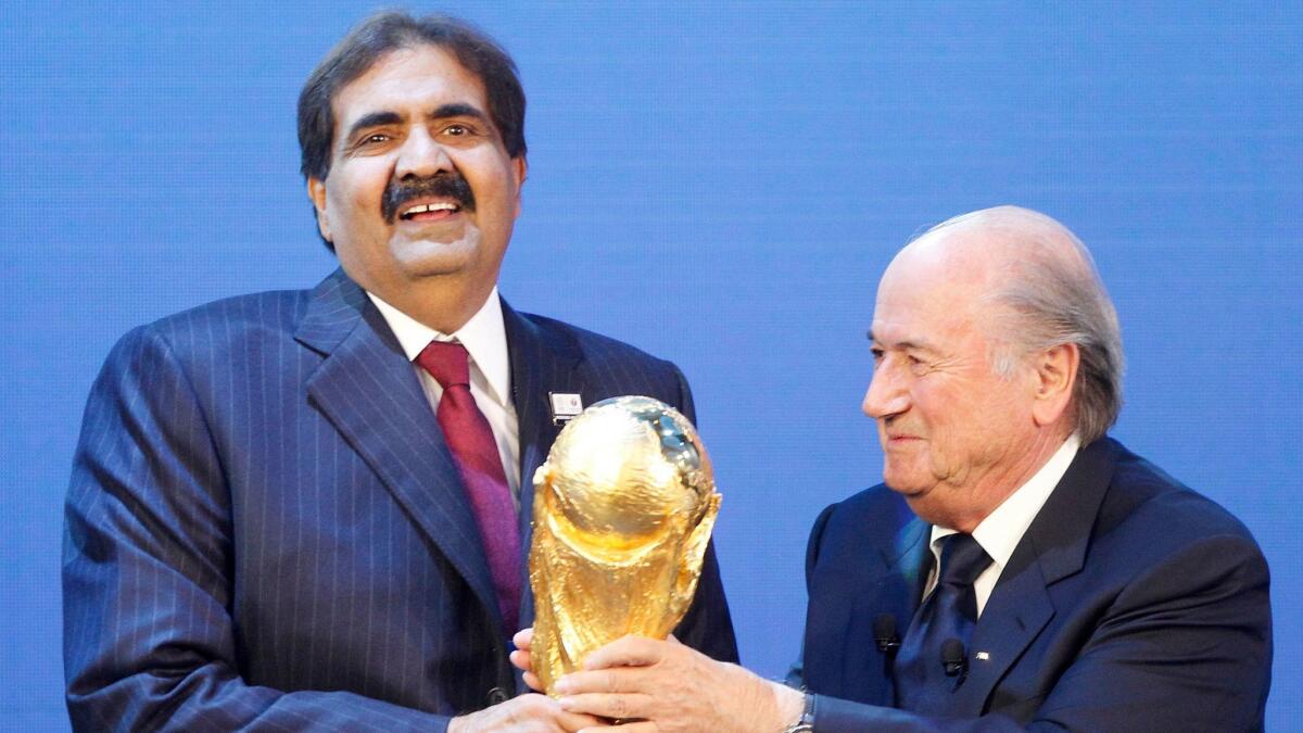 Sheikh Hamad bin Khalifa Al-Thani, then the emir of Qatar, and then-FIFA President Sepp Blatter, after the announcement that Qatar would be the 2022 World Cup host.