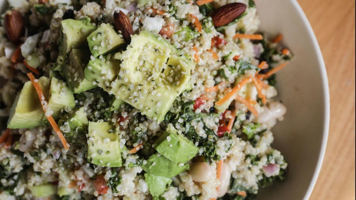 A quinoa-based salad with avocados, carrots and almonds is one of the best sellers at Veggie Grill.