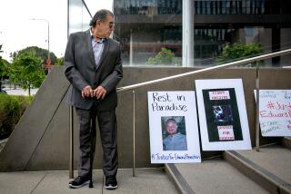 Los Angeles, CA - May 10: Edward Tapia, the father of Edward Bronstein, -- a 38-year-old Burbank man who died while being restrained by CHP officers in 2020 after refusing to have his blood drawn following a traffic stop on the Golden State (5) Freeway -- looks down at posters calling for justice for his son at a press conference announcing a $24 million civil rights settlement against the state on Wednesday, May 10, 2023 in Los Angeles, CA. (Jason Armond / Los Angeles Times)