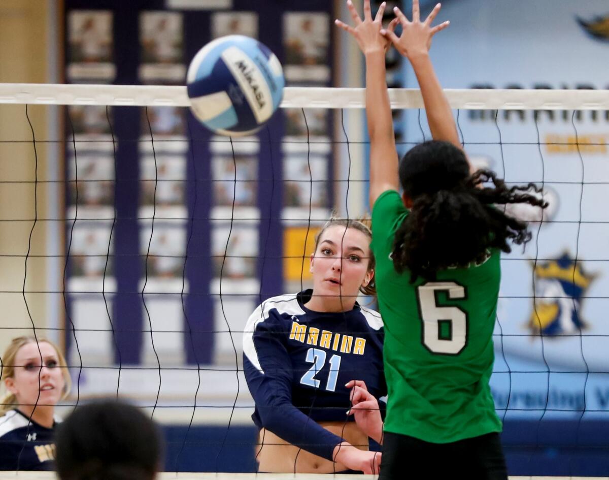 Marina's Dominique Vadeboncoeur kills a ball during a CIF Southern Section Division 5 playoff match against Monrovia.