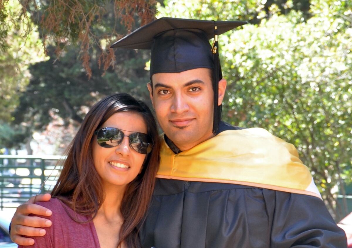 In this photo provided by the family of Abdulrahman al-Sadhan, Abdulrahman al-Sadhan poses with his sister Areej Al Sadhan for a graduation photo, at Notre Dame de Namur University, a private Catholic university, in Belmont, California, May 4, 2013. Saudi humanitarian aid worker Abdulrahman al-Sadhan’s anonymous Twitter account used to parody issues about the economy in Saudi Arabia has landed him in prison in the kingdom. But his story may have roots in an elaborate ploy that began in Silicon Valley and sparked a federal case against two Twitter employees accused of spying for the kingdom. (Family of Abdulrahman al-Sadhan via AP)