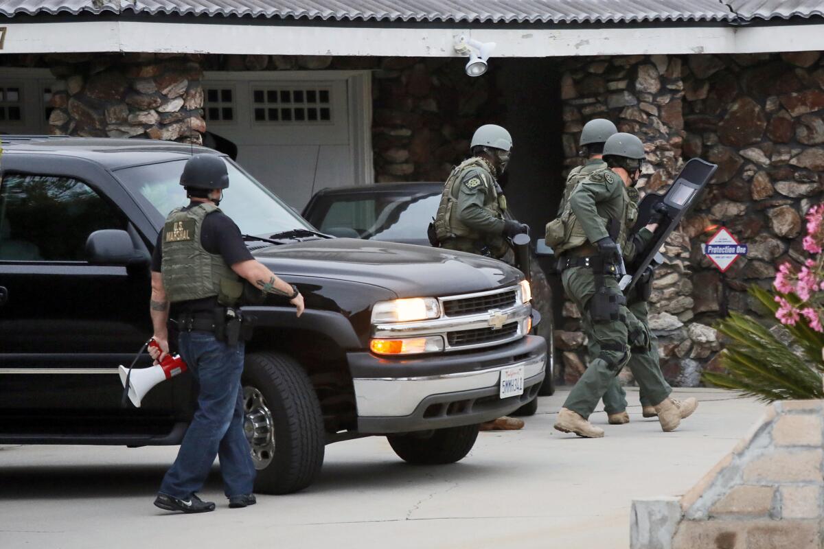 In this file photo, U.S. marshals raid a home in Montebello as part of Operation Sudden Impact.