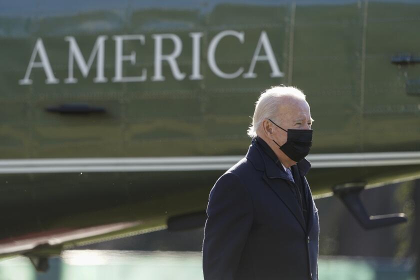 President Joe Biden walks to the Oval Office of the White House after stepping off Marine One, Monday, Jan. 10, 2022, in Washington. Biden is returning to Washington after spending the weekend at Camp David. (AP Photo/Patrick Semansky)