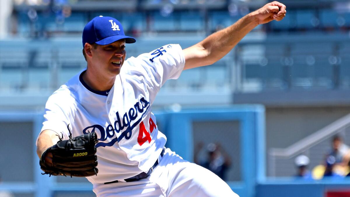 Dodgers starter Rich Hill follows through on a pitch against the Diamondbacks during the first inning Sunday.