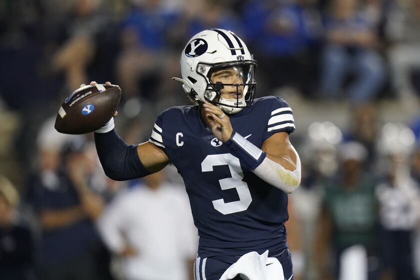 BYU quarterback Jaren Hall (3) throws downfield during the first half of an NCAA college football game against Wyoming Saturday, Sept. 24, 2022, in Provo, Utah. (AP Photo/Rick Bowmer)