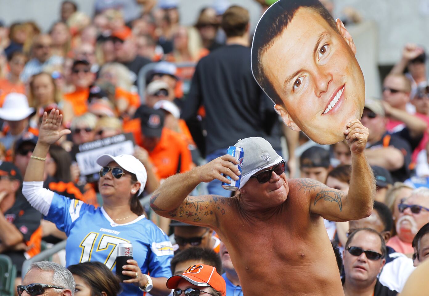 A Chargers fan holds up a Philip Rivers head during the Bengals game in Cincinnati on Sept. 20, 2015.