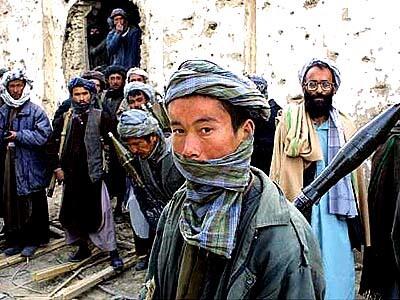 Northern Alliance fighters gather near a prison after the end of fighting.