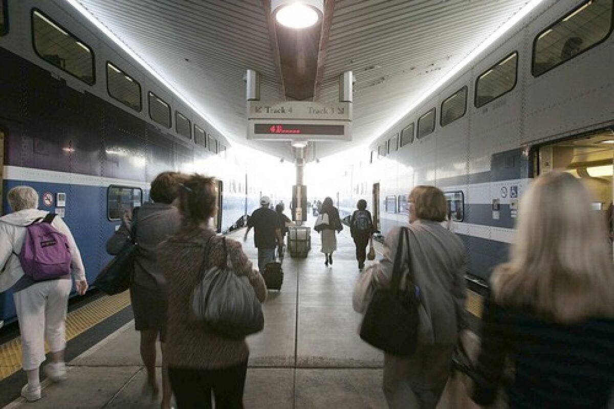 Passengers board trains at Union Station. Many of Metrolinks board members rely on reports from staff to stay informed of riders concerns.