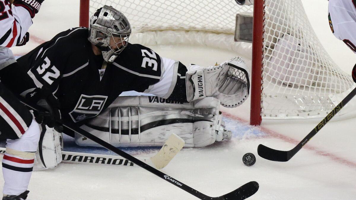 Kings goalie Jonathan Quick makes a save on a shot by Chicago Blackhawks forward Brandon Saad during the Kings' win in Game 3 of the Western Conference finals. Quick has played well at critical moments this postseason.