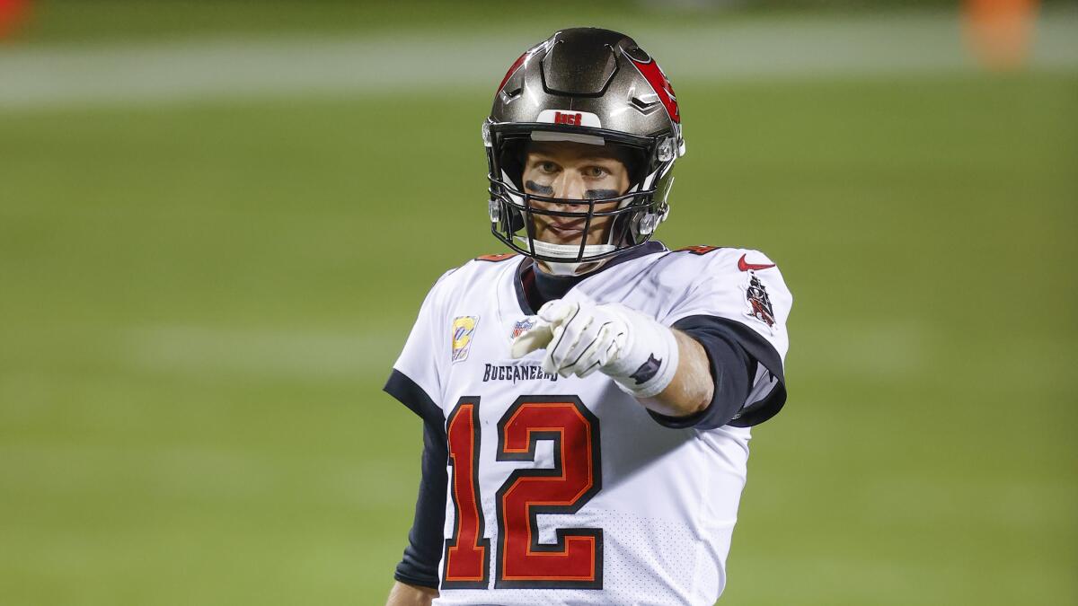 Tampa Bay Buccaneers quarterback Tom Brady points during a game.