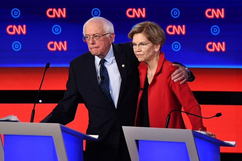 Democratic presidential hopefuls US senator from Vermont Bernie Sanders (L) and US Senator from Massachusetts Elizabeth Warren hug after participating in the first round of the second Democratic primary debate of the 2020 presidential campaign season hosted by CNN at the Fox Theatre in Detroit, Michigan on July 30, 2019. (Photo by Brendan Smialowski / AFP)BRENDAN SMIALOWSKI/AFP/Getty Images ** OUTS - ELSENT, FPG, CM - OUTS * NM, PH, VA if sourced by CT, LA or MoD **
