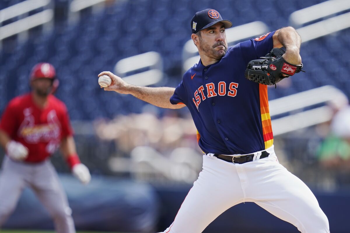 Houston Astros starting pitcher Justin Verlander pitches in the first inning of a spring training baseball game against the St. Louis Cardinals, Wednesday, March 23, 2022, in West Palm Beach, Fla. (AP Photo/Sue Ogrocki)