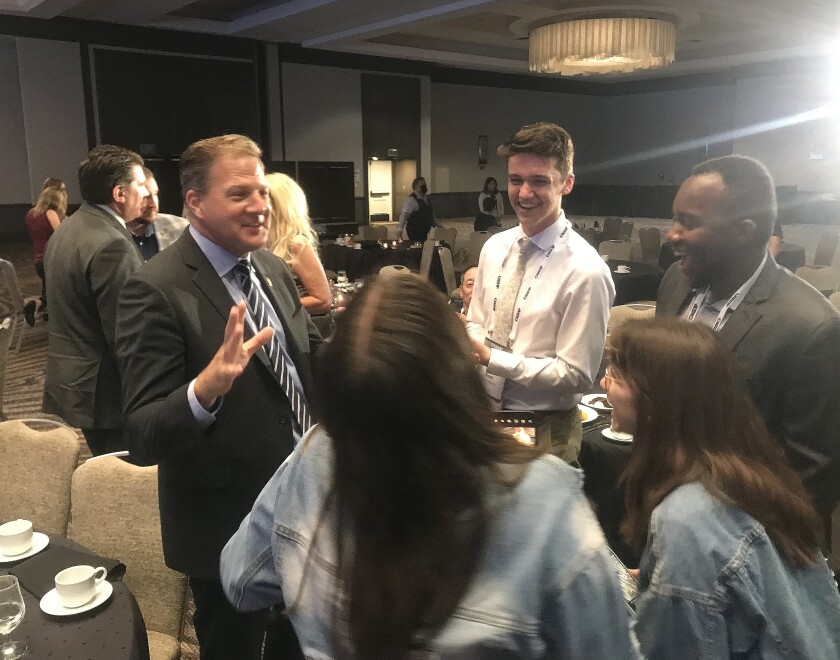New Hampshire Governor Chris Sununu talks to GOP delegates