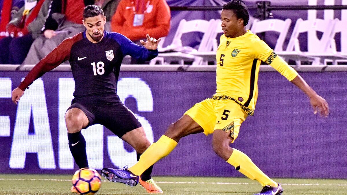 U.S. midfielder Sebastian Lletget, who also plays for the Galaxy, tries to work his way past Jamaica's Alvas Powell during a game in February.