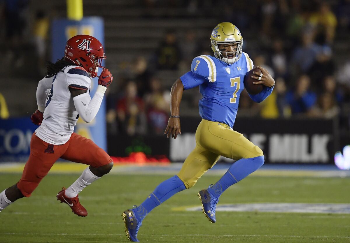 UCLA quarterback Dorian Thompson-Robinson runs the ball as Arizona last weekend.