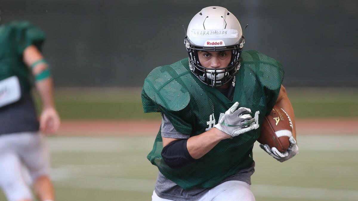 Nicholas Karahalios, pictured carrying the ball during a Sage Hill School practice on Aug. 9, rushed for 1,000 yards and 16 touchdowns for the Lightning in the 2018 season.