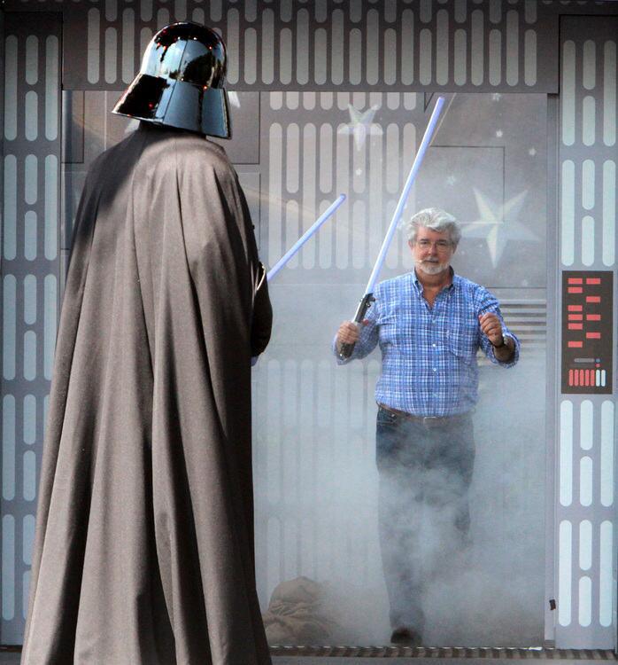 Star Wars creator George Lucas surprises Darth Vader during the launch ceremony for the "Star Tours - The Adventures Continue" 3D-simulator attraction, at Disney's Hollywood Studios in Lake Buena Vista, Fla., Friday, May 20, 2011. The launch of the attraction anchored the annual Star Wars Weekends.