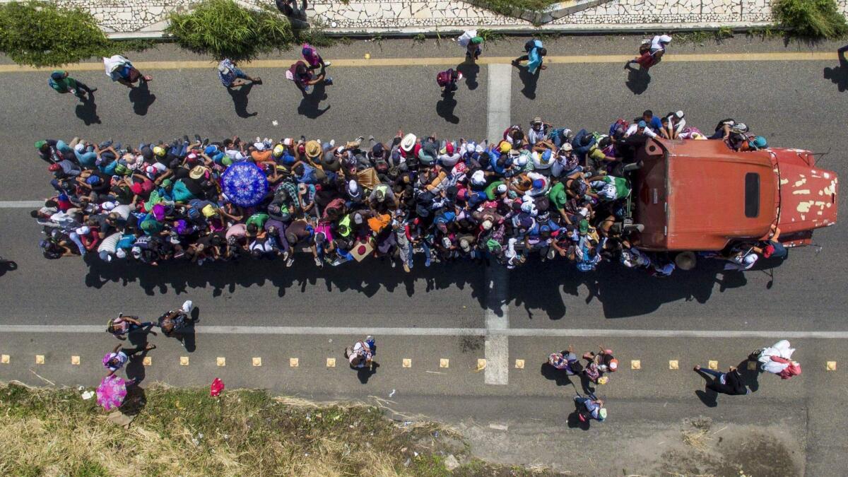 Aerial view of Honduran migrants onboard a truck in Mexico as they take part in a caravan heading toward the U.S.