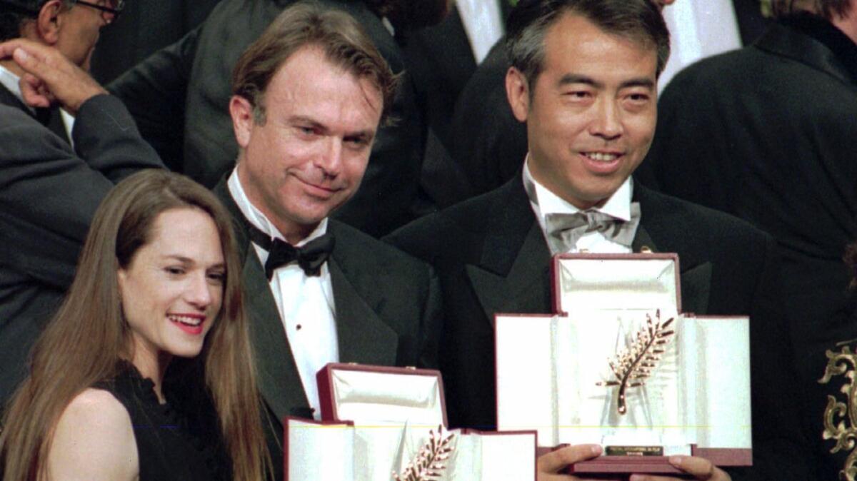 Palme split: from left, best actress winner Holly Hunter, actor Sam Neill for director Jane Campion and director Chen Kaige accepting the shared Palme d'Or for "The Piano" and "Farewell My Concubine."