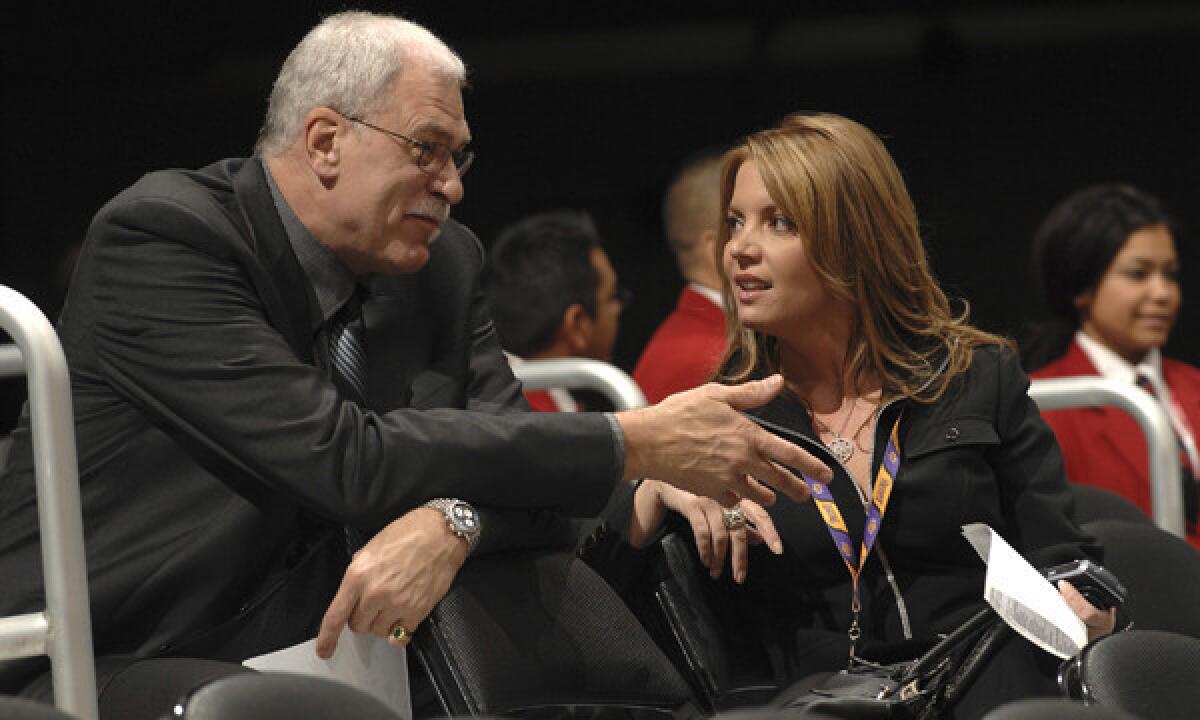 Former Lakers coach Phil Jackson, shown with fiancee Jeanie Buss in 2007, says the late Jerry Buss made the final decision on hiring Mike D'Antoni as coach of the Lakers in 2012.