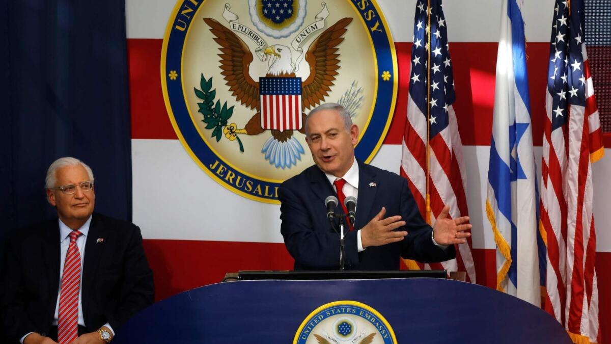 U.S. Ambassador to Israel David Friedman listens as Israeli Prime Minister Benjamin Netanyahu delivers a speech during the opening of the U.S. Embassy in Jerusalem.