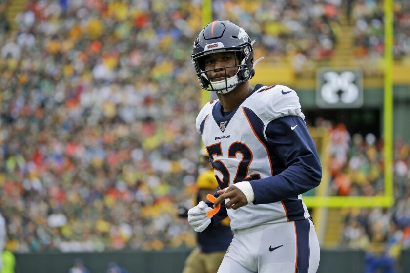Denver Broncos linebacker Justin Hollins takes up his position during the first half of an NFL football game against the Green Bay Packers Sunday, Sept. 22, 2019, in Green Bay, Wis. (AP Photo/Mike Roemer)