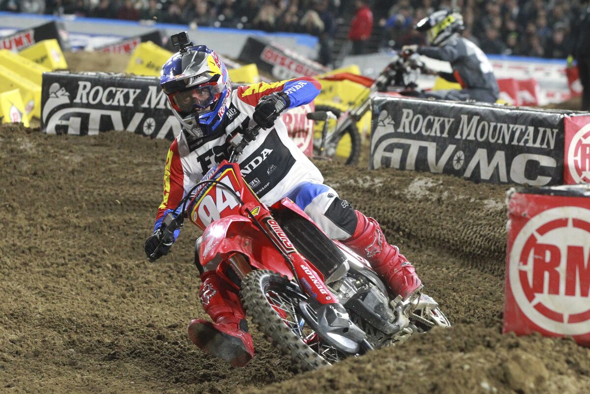 A Supercross rider on a dirt track