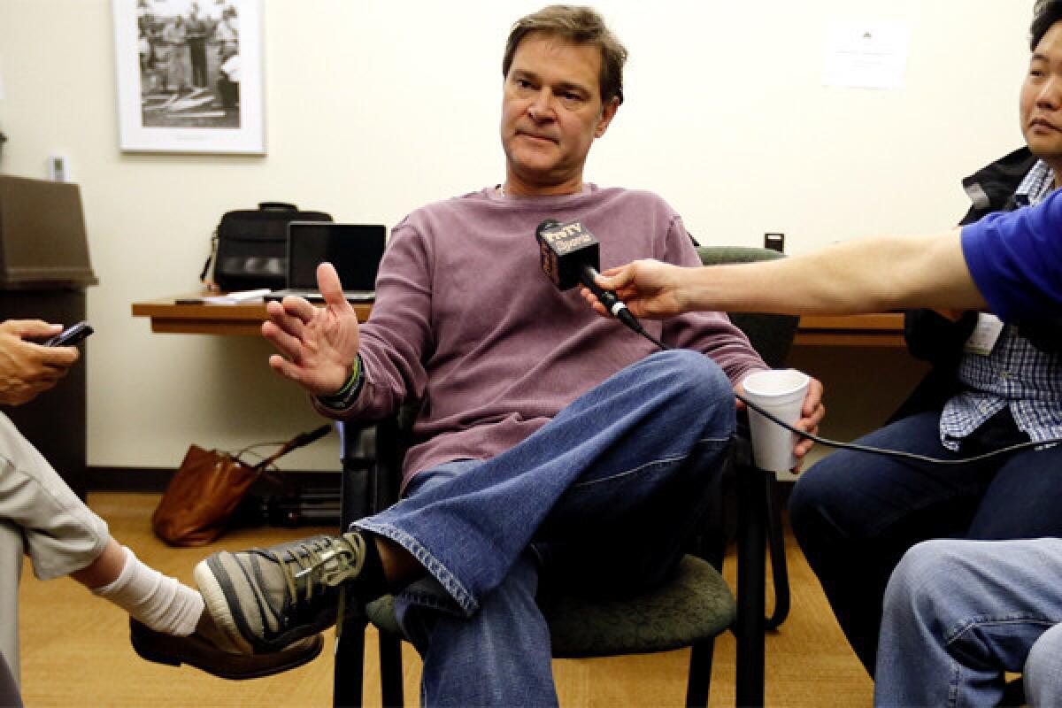 Dodgers Manager Don Mattingly speaks to reporters from Camelback Ranch, where pitchers and catchers reported on Saturday.